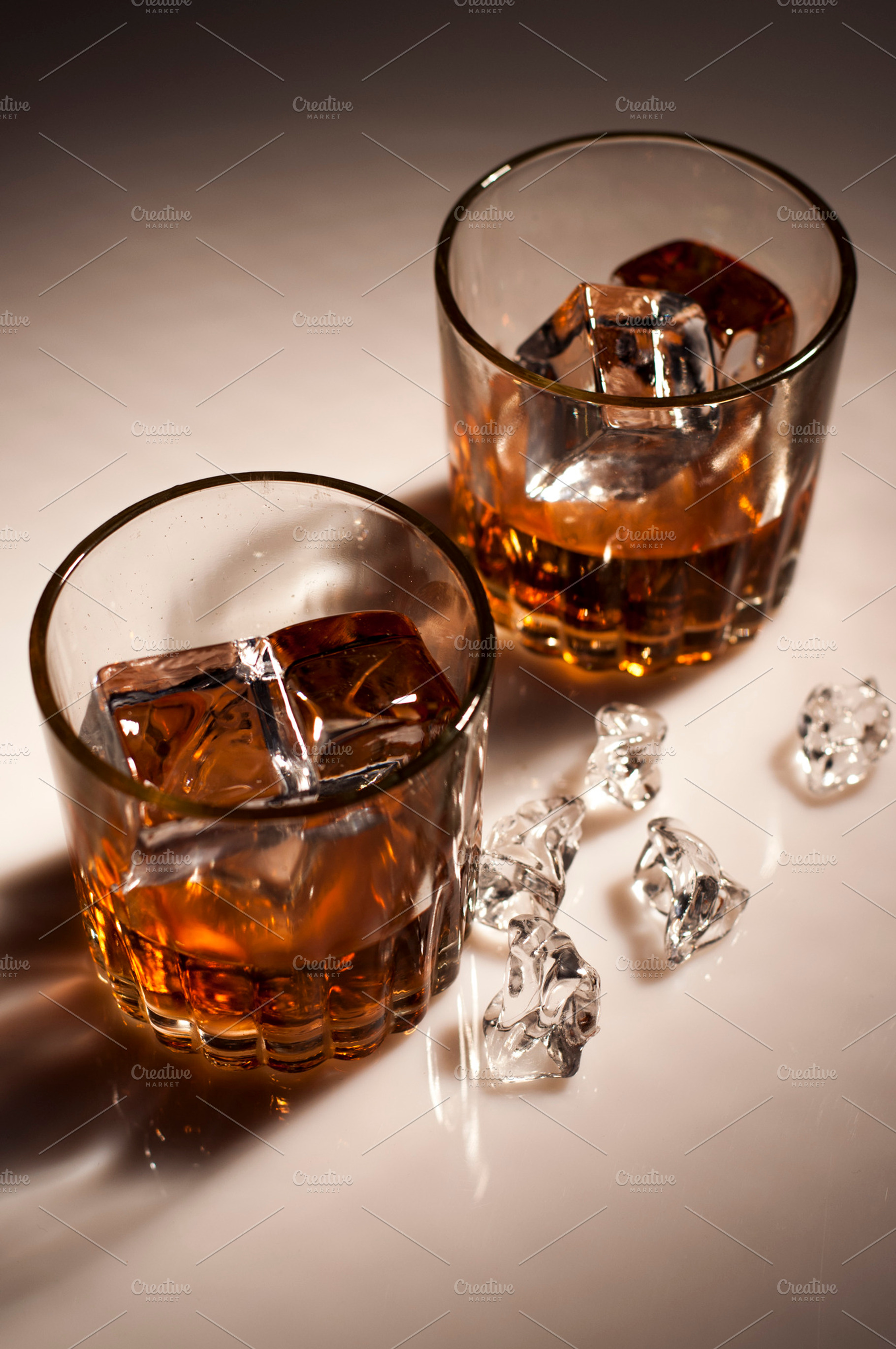 Alcohol With Ice Containing Cocktail Glass And Jar