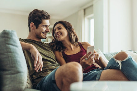 Loving couple relaxing on sofa featuring bonding, boyfriend, and casuals, a Person Photo by Jacob Lund