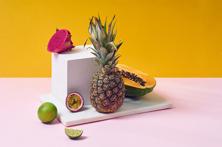 Tropical fruits variety on a colorful background. Side view with