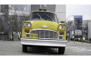 Classic yellow taxi cab parked on, a Transportation Photo by Media Whale Stock