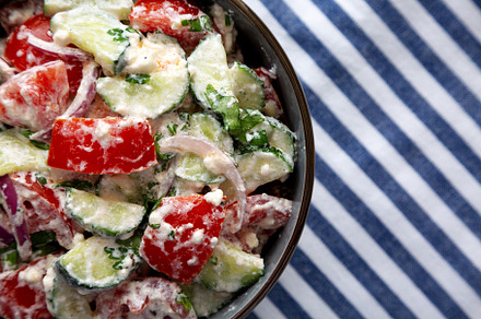 Homemade Tomato Cucumber Feta Salad in a Bowl, top view. Flat la, a Food & Drink Photo by LiudmylaChuhunova