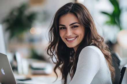 Young woman working with her laptop, a Photo by Pavel_design
