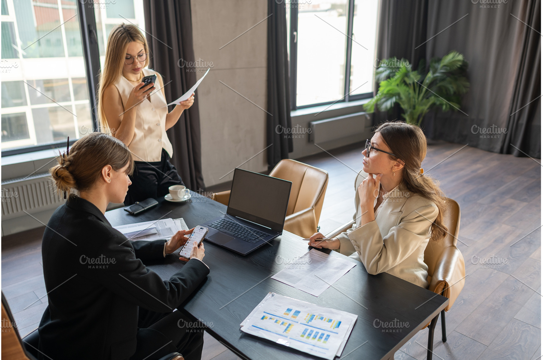 Businesswomen in a stylish office, a Business Photo by undrey