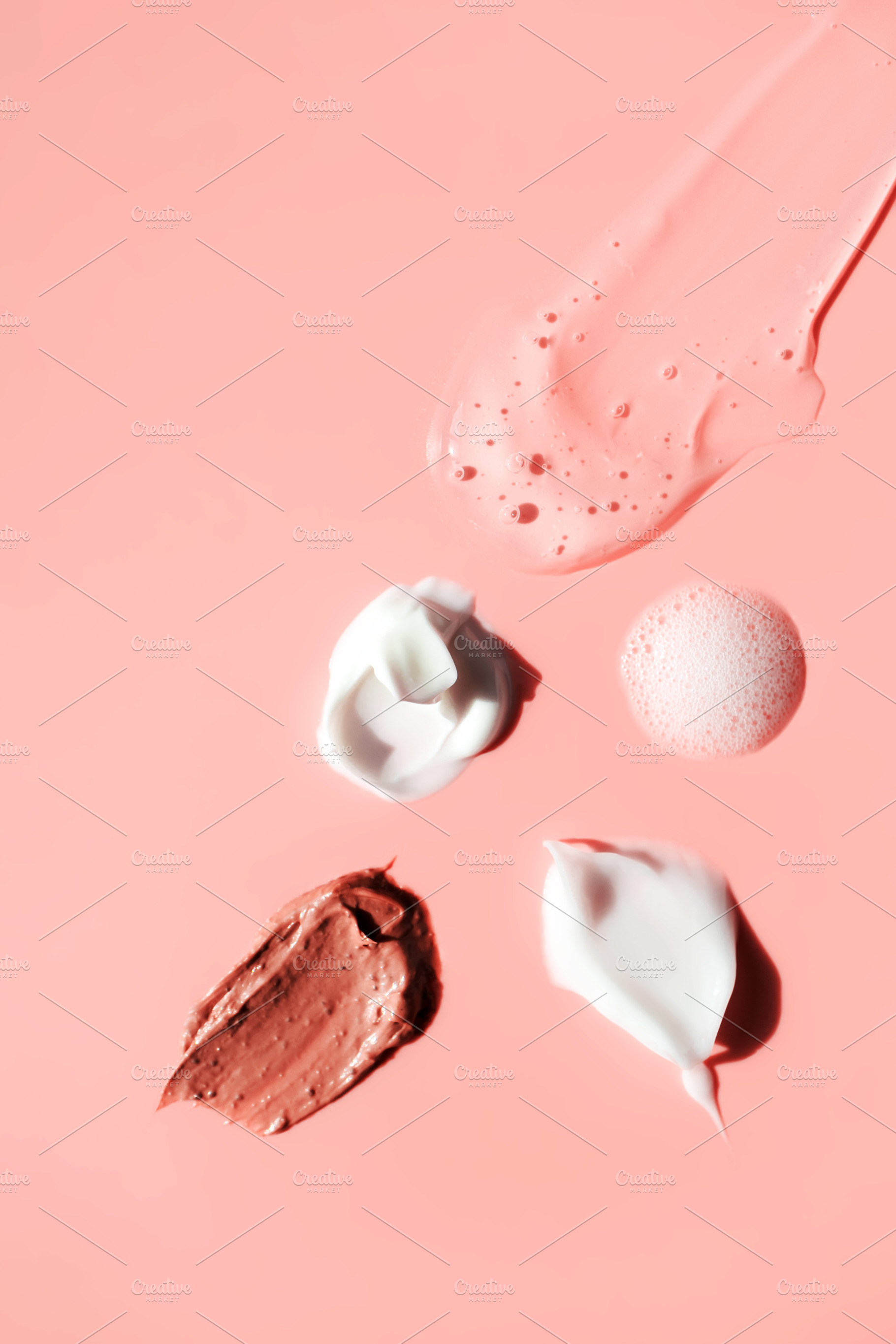 Various cosmetic smears on a pink, a Beauty & Fashion Photo by Olha Kozachenko