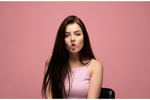 Young woman making a fish face, a Person Photo by volodymyrshtun13795