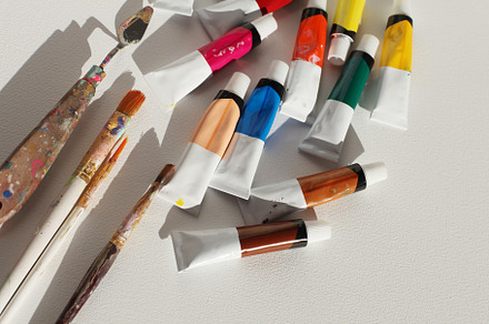 Acrylic paints in tubes and brushes, an Arts & Entertainment Photo by Liliia Rudchenko