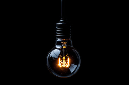 Lightbulb on black background, a Technology Photo by MistyDay