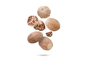 Nutmeg and broken pieces flying on a, a Food & Drink Photo by innakreativ
