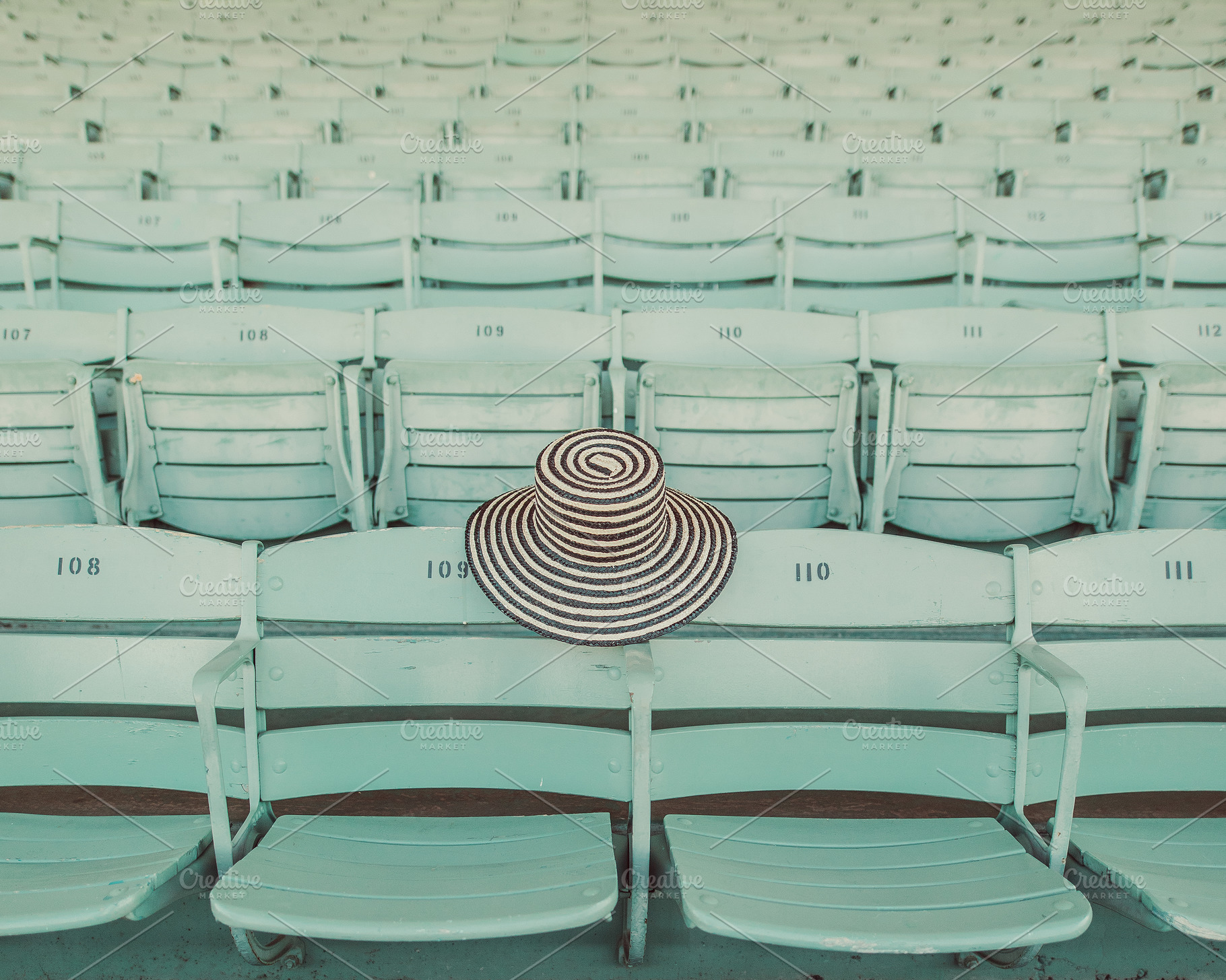 Retro Green Seats & Hat Stock Photo, an Architecture Photo by Munopia