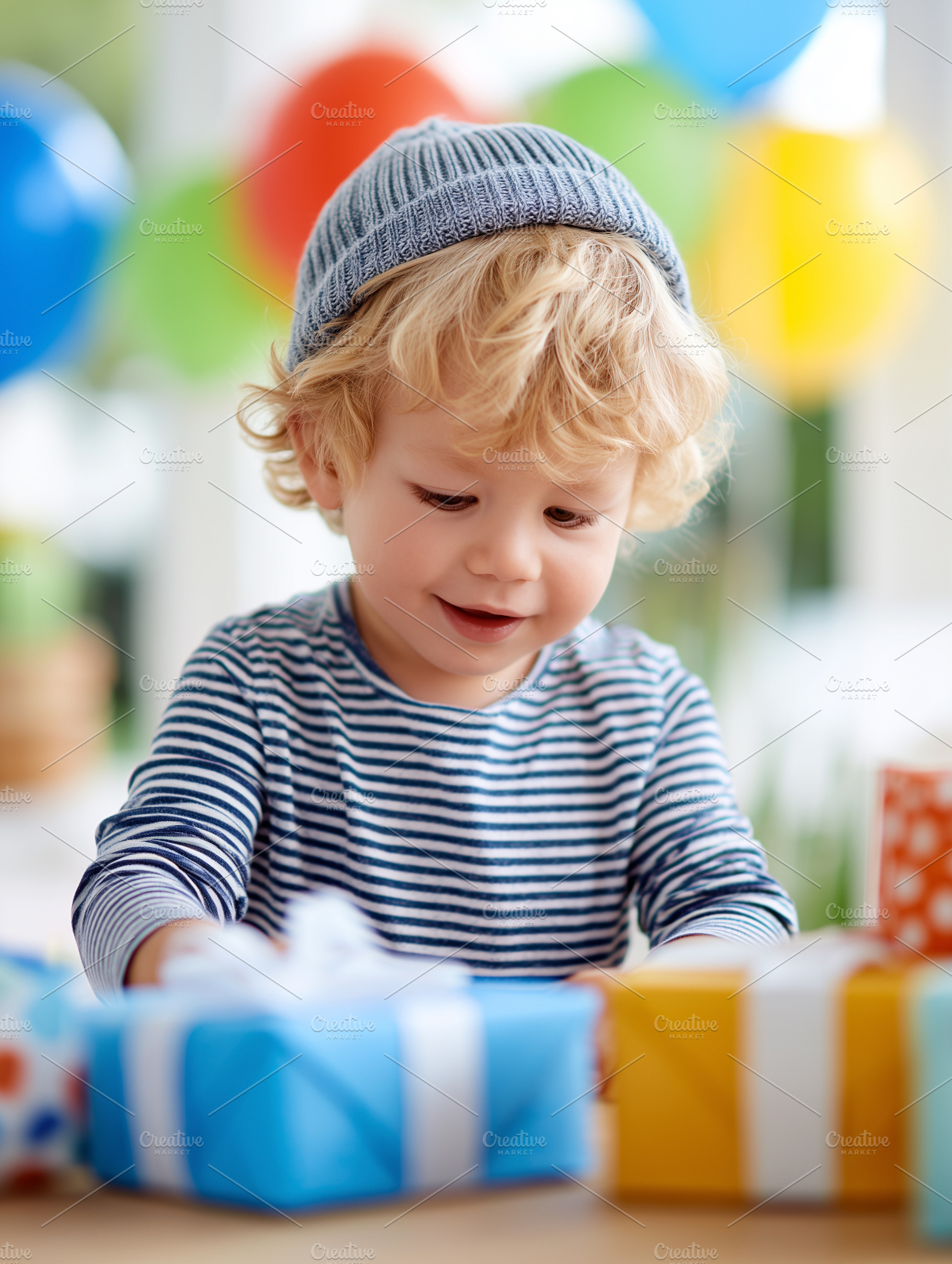 Cute toddler boy opening gifts, a Person Photo by MistyDay