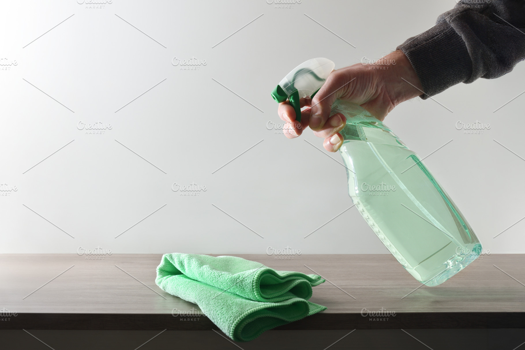 Hand with applying product for house cleaning white islated back, a Health & Medical Photo by Davizro's Market
