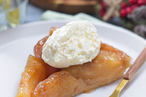 Slice of apple Tart Tartin with whipped cream, french upside down cake, vertica, a Food & Drink Photo by iuliia_n