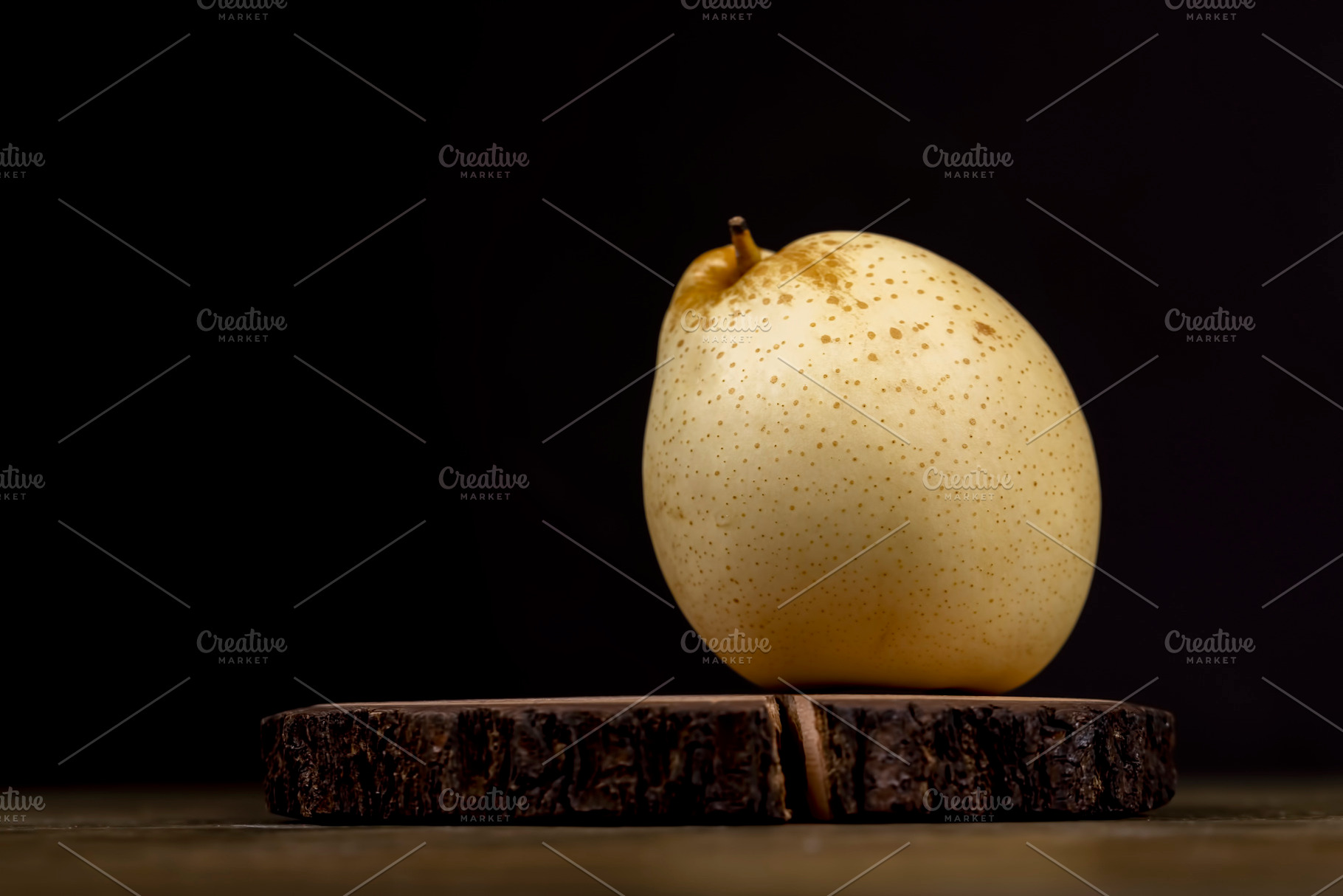 ripe white pear with a yellow colour on the table, a Photo by rsoollAI