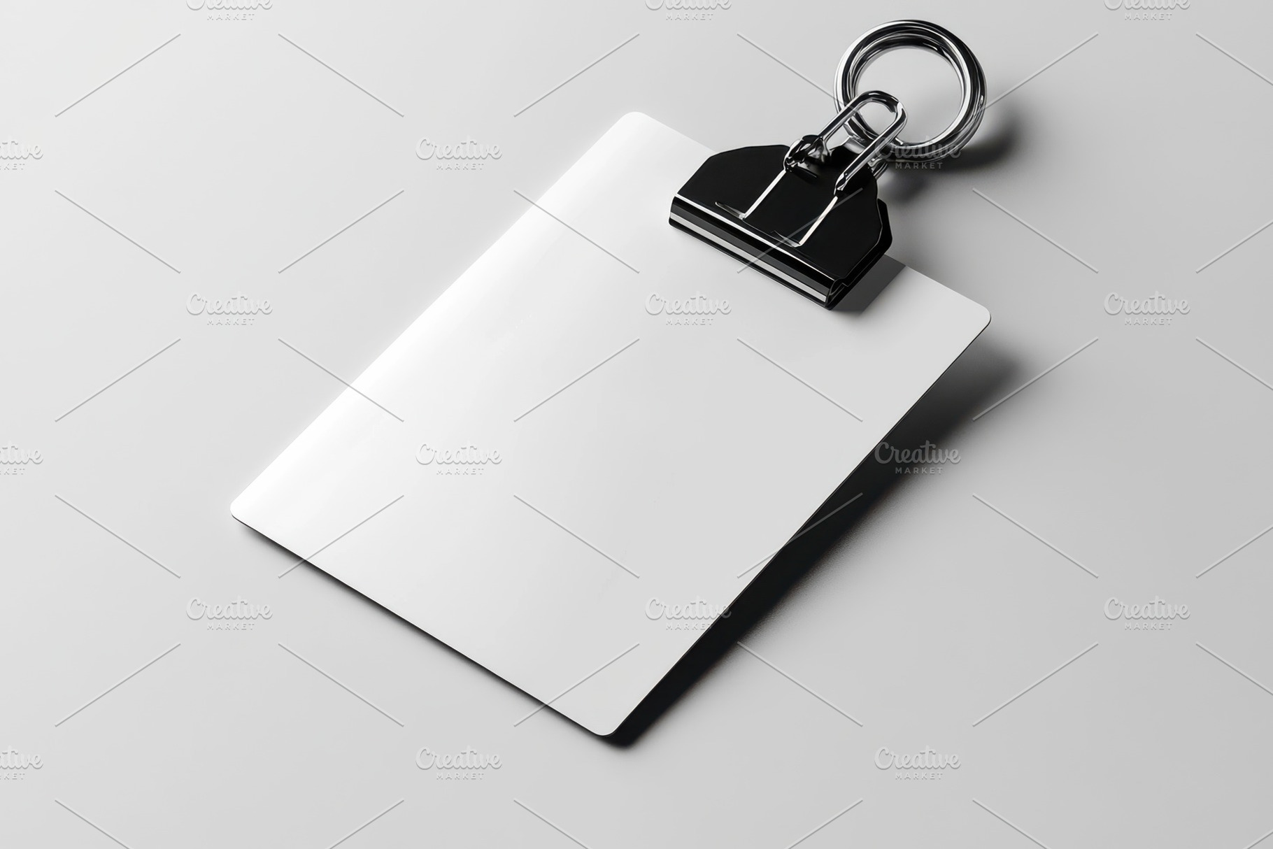 Blank White Clipboard with Metal Cli, a Background Photo by Pixeness Studio
