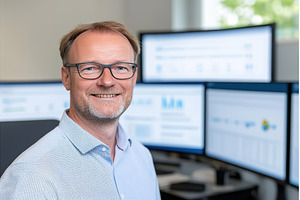 Man with Glasses Smiling in Front of, a Business Photo by Lermont51