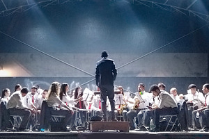 Youth symphony orchestra on stage, a Person Photo by DanFLCreativo