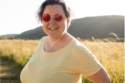 The joyful young woman in sunglasses, a Person Photo by oksix