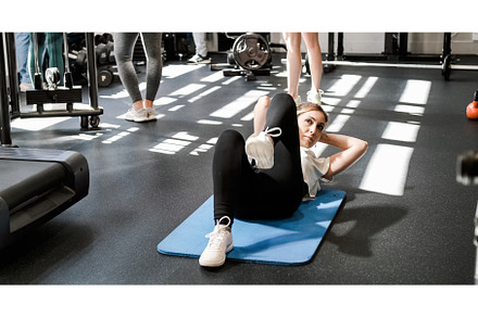 Athletic woman doing exercises in, a Sports & Recreation Photo by Daniel Megias