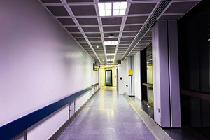 Empty modern airport corridor and terminal walkway in Manchester with reflectiv, a Photo by AS photostudio