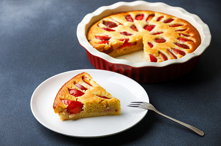 Homemade plum pie with almond flour with a piece served on plate, a Food & Drink Photo by serkum