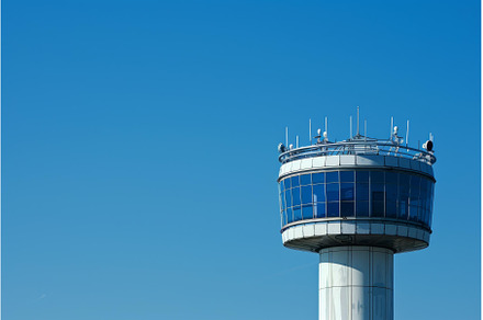 Airport control tower standing tall, a Transportation Photo by Ylivdesign