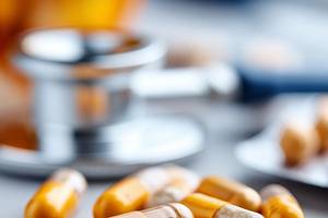 Close up of yellow medicine capsules, a Health & Medical Photo by MistyDay