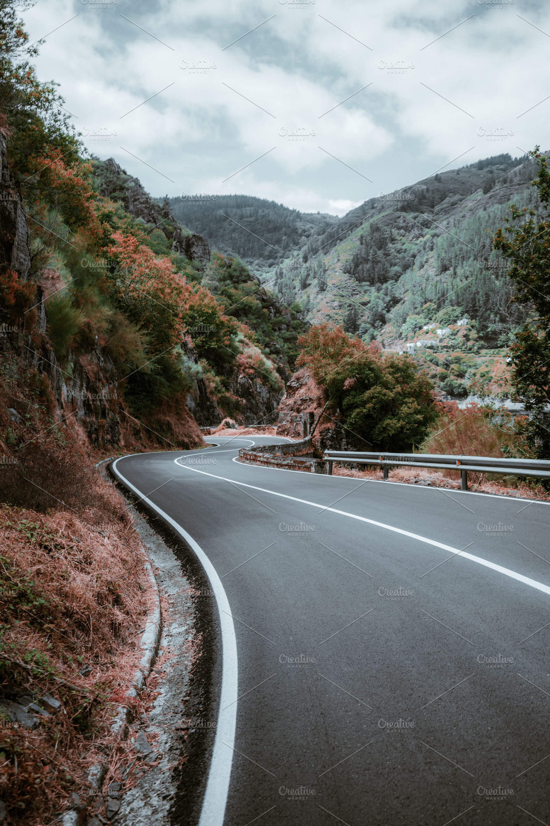 Winding autumn mountain road, a Transportation Photo by SkyNext