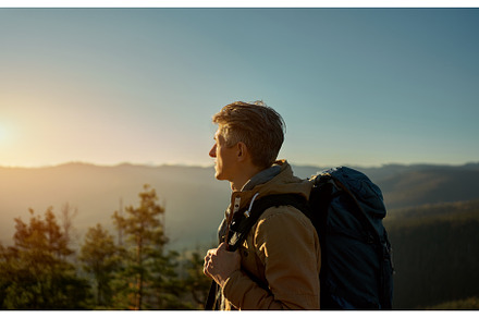 Man traveler with backpack standing, a Nature Photo by vitaliymateha photography