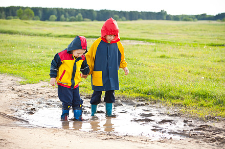 Two boys walking through a mud puddl preview 6
