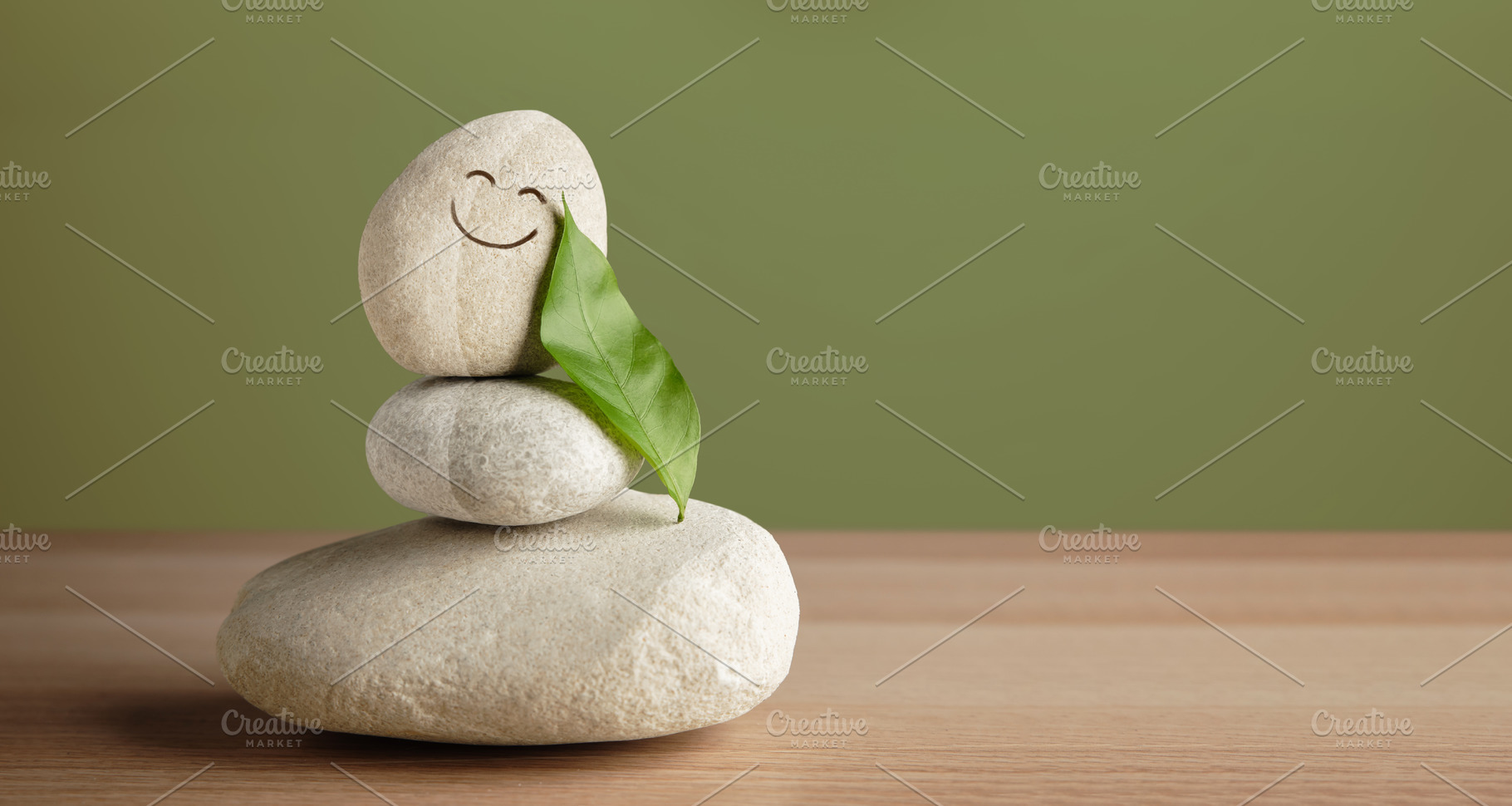 Smiling stone with leaf shows harmony of life, happiness, nature, a Photo by salmon.black