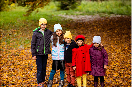 Group of friends play in autumn park, a Person Photo by oksix