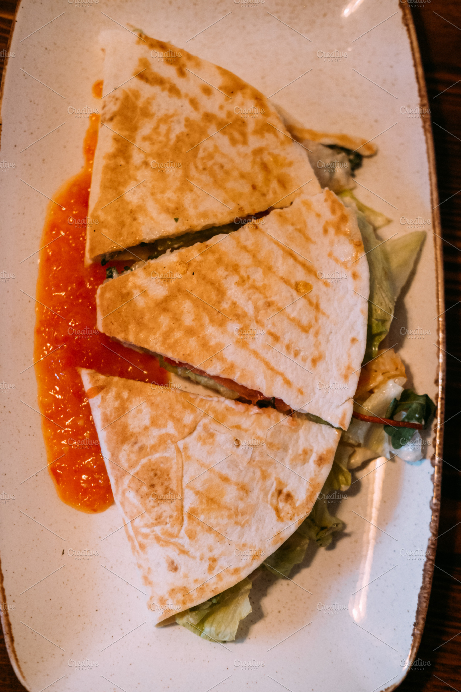 Pita sandwich cut burrito stuffed flatbread served, a Food & Drink Photo by Photo Drive Studio