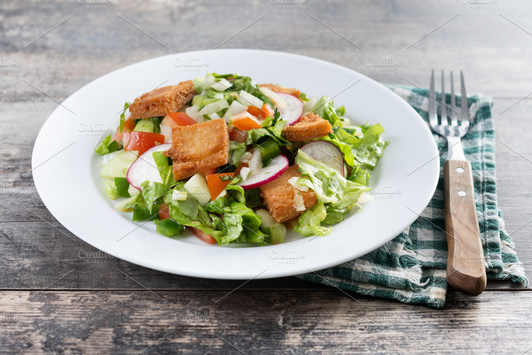 Fattoush salad, Traditional Lebanese Salad on wooden table, a Food & Drink Photo by etorres69