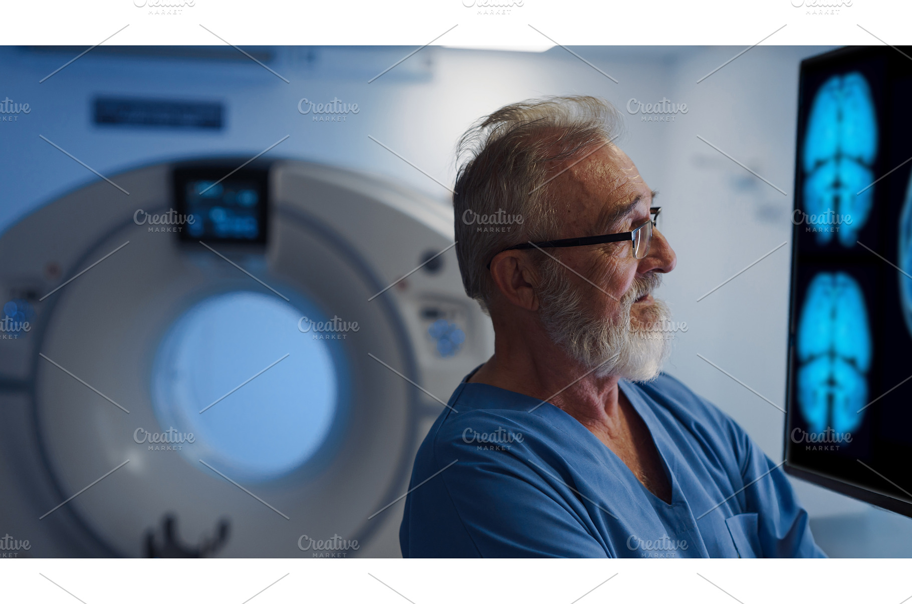 Portrait of doctor looking at CT, a Health & Medical Photo by HalfPoint