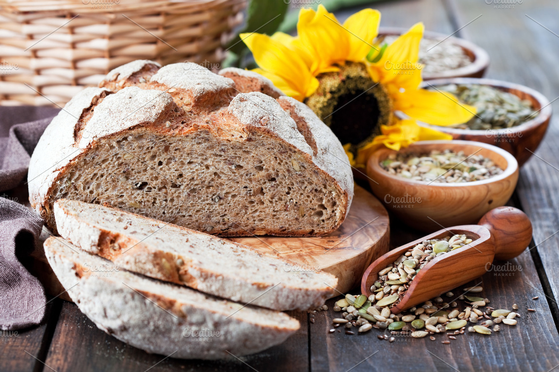 Whole grain bread with seeds of sunflower, pumpkin, flax and hemp, a Food & Drink Photo by Y. A. Photo