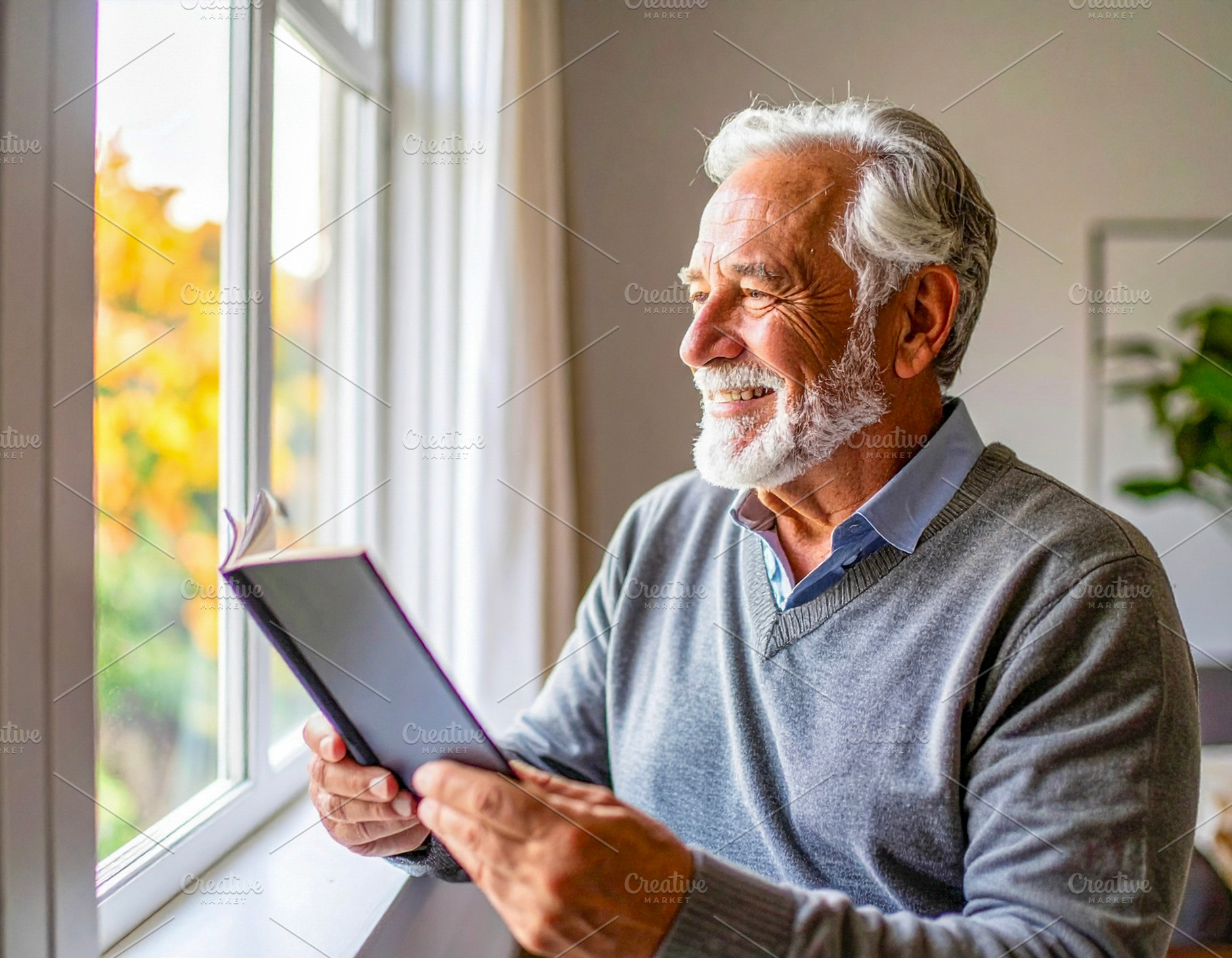 Senior man holding tablet by window with soft light, a Photo by DanFLCreativo