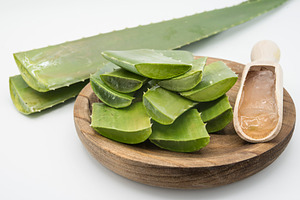 Aloe vera leaves and glass of aloe v containing aloe, aloe plant, and aloe