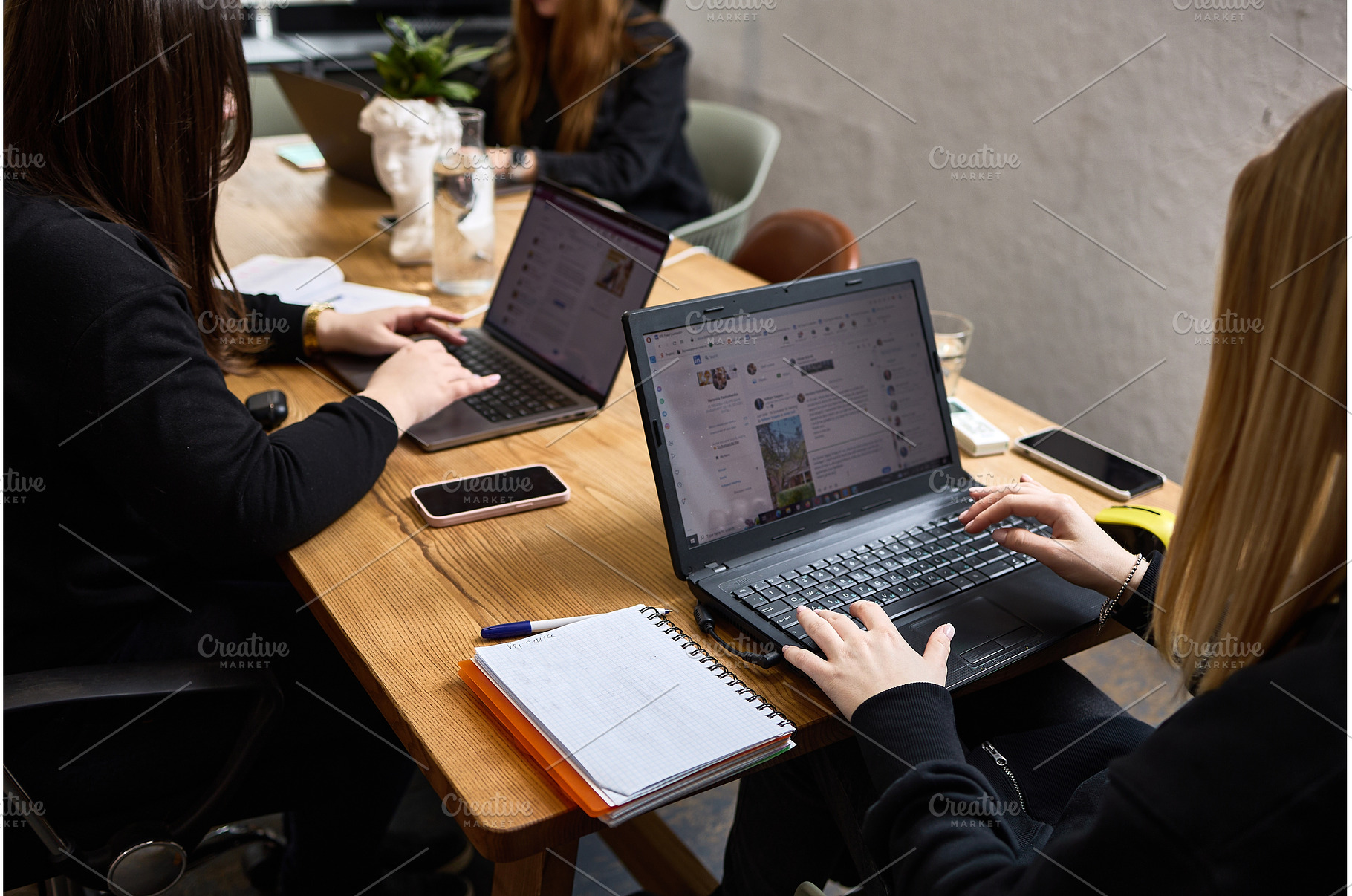 Women collaborating in modern, a Business Photo by wip3out
