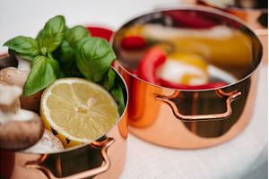 Fresh ingredients in copper pots, a Food & Drink Photo by HalfPoint