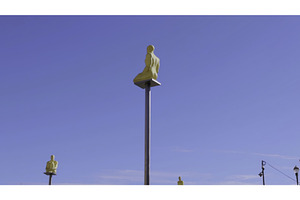 Golden statues sitting on poles, an Architecture Photo by Media Whale Stock