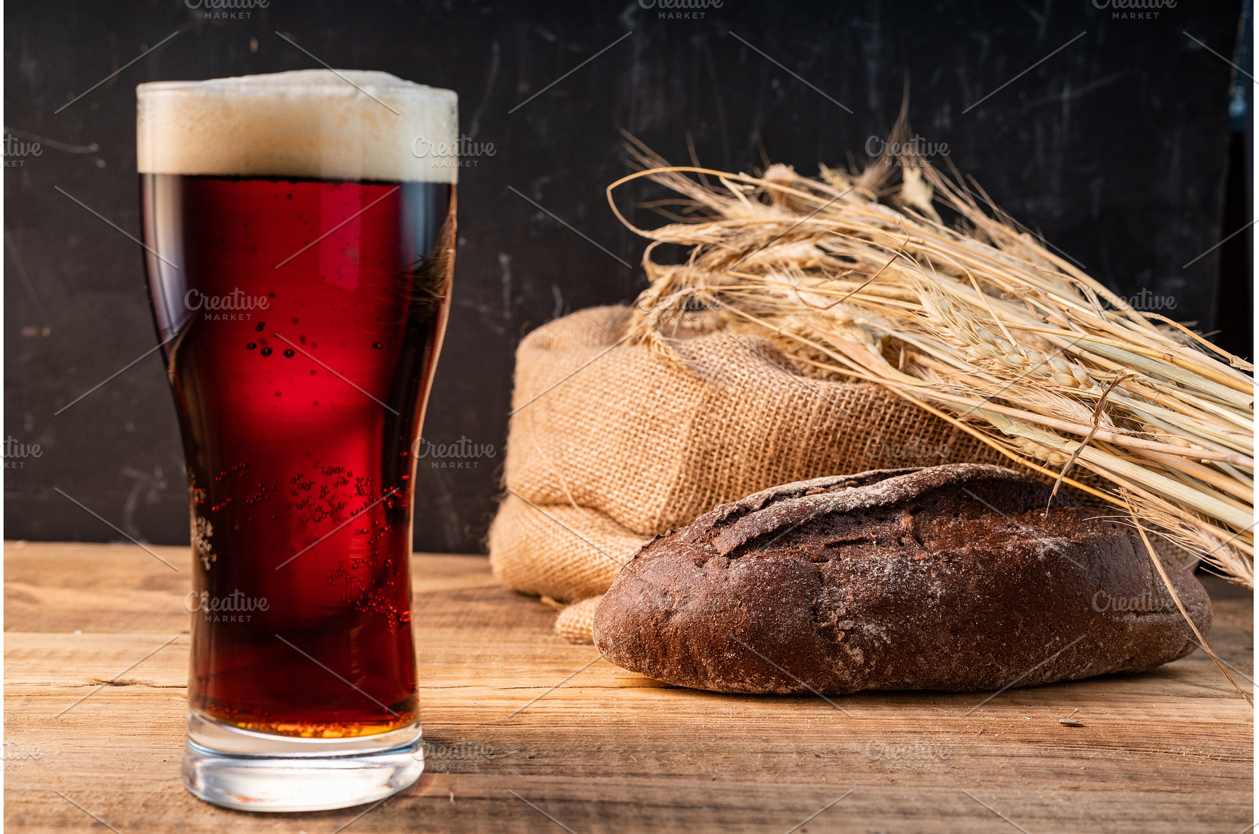 Glass of dark beer with a tall foamy, a Food & Drink Photo by Stockphoto by vzwer