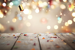 Festive bokeh lights above wooden ta, a Photo by Dvoevnore photos