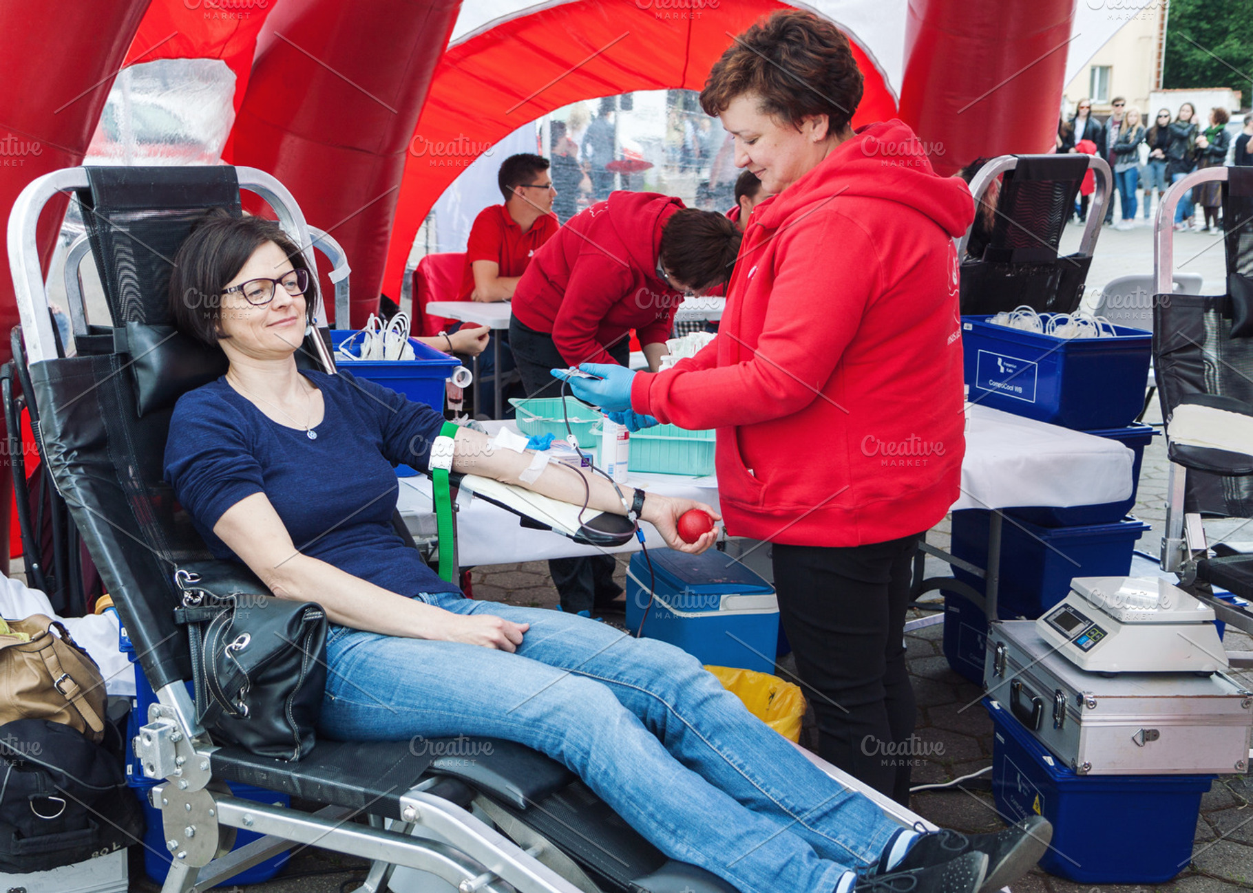Young woman donating blood, a Health & Medical Photo by BOOCYS