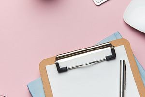 Workspace organizing accessories on pink tabletop for business p, a Business Photo by Olena Rudo