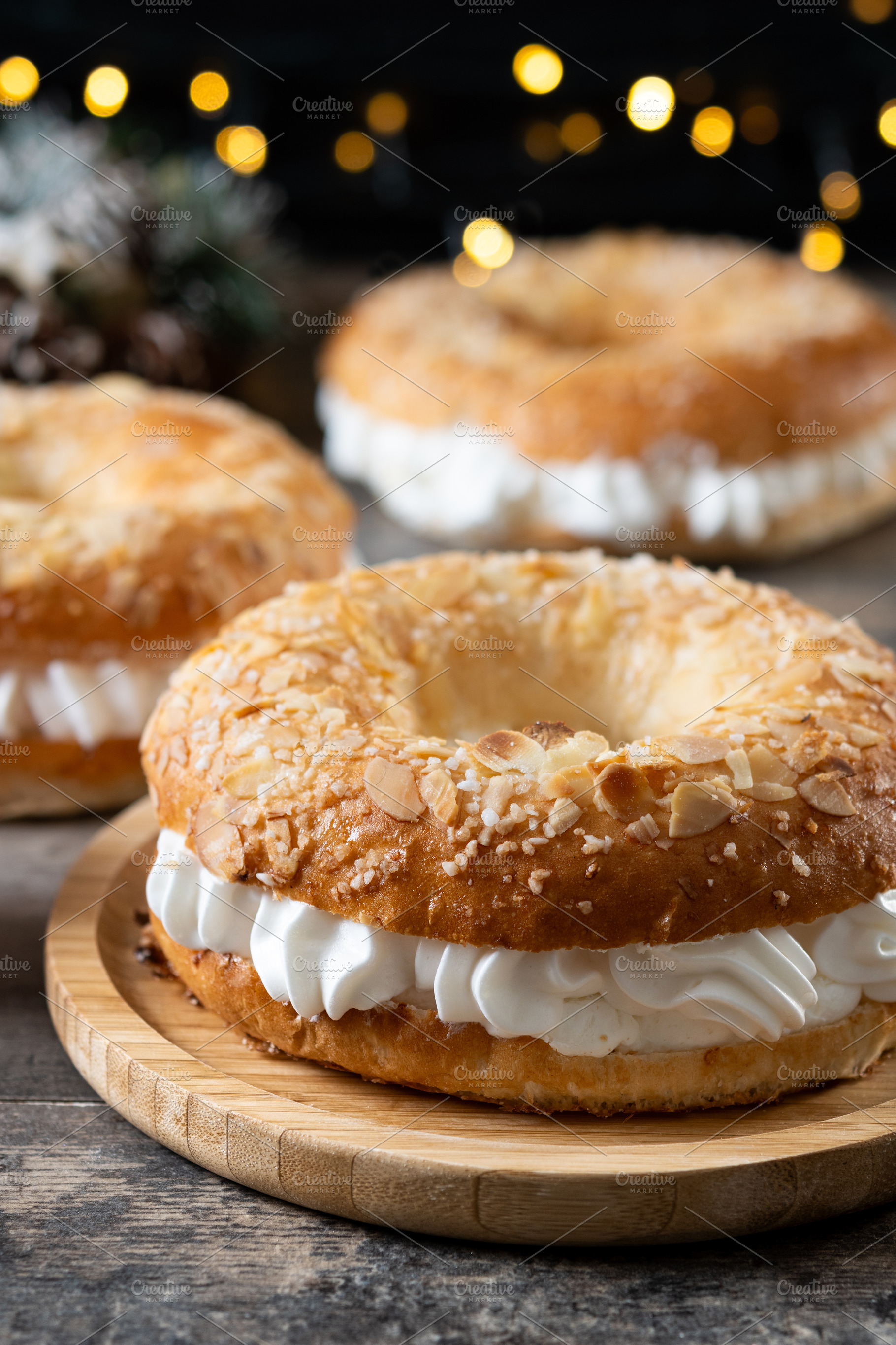 Close-up of a traditional Spanish Roscón de Reyes filled with whipped cream, d, a Food & Drink Photo by etorres69