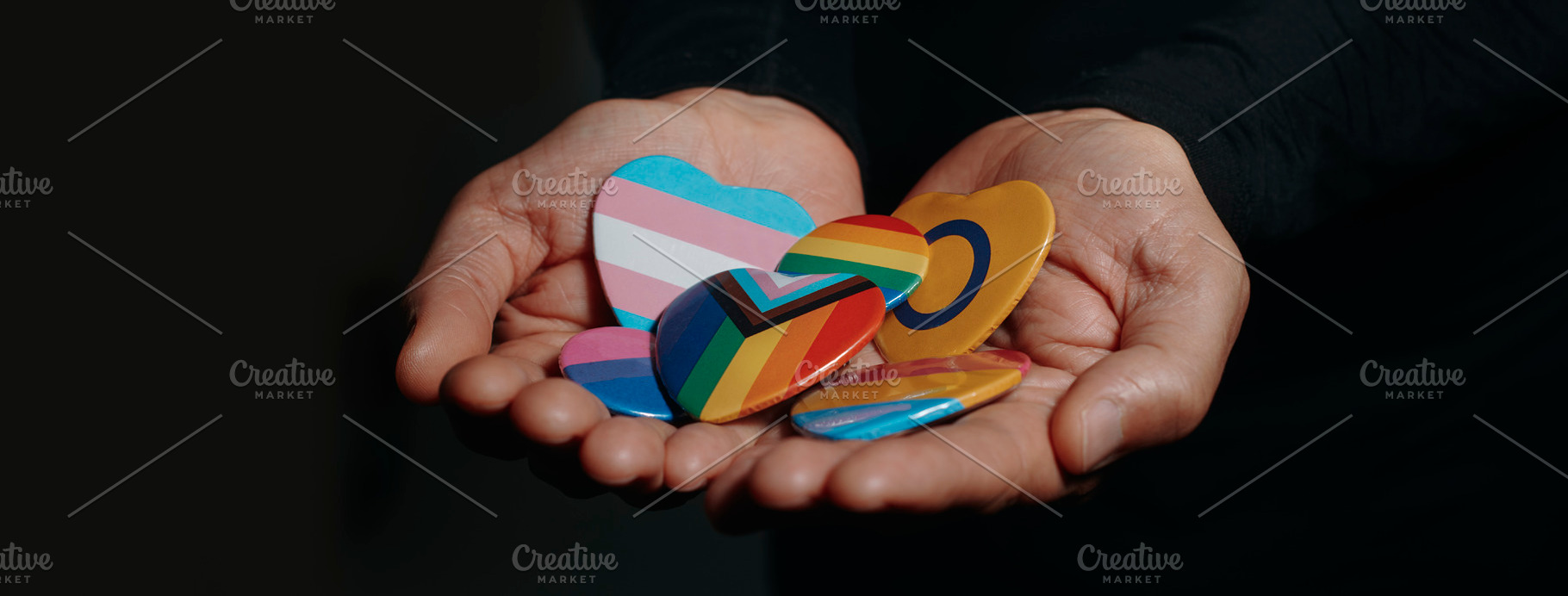 badges with different LGBTQ flags, web banner, a Photo by Nito