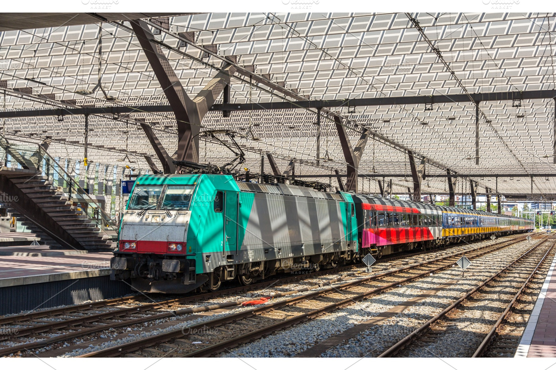 Dutch intercity train on Rotterdam station, a Transportation Photo by Leonid Andronov