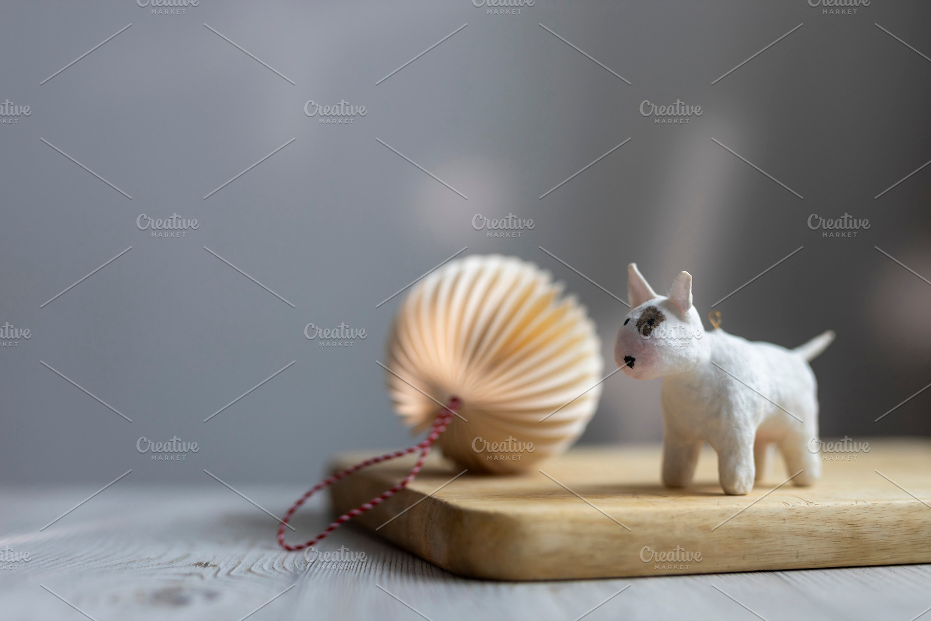 Small white handmade dog figurine st, a Wallpaper Photo by Imaginarium