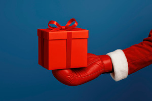 Santa Claus boxing with a gift, generative AI, a Photo by Nito