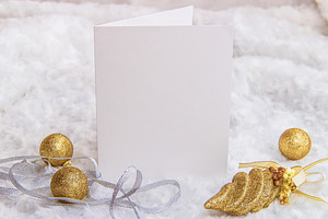 Mockup. White card, golden Christmas